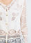 Effen, opengewerkte blouse met knopen en borduureffect