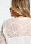 Effen, opengewerkte blouse met knopen en borduureffect
